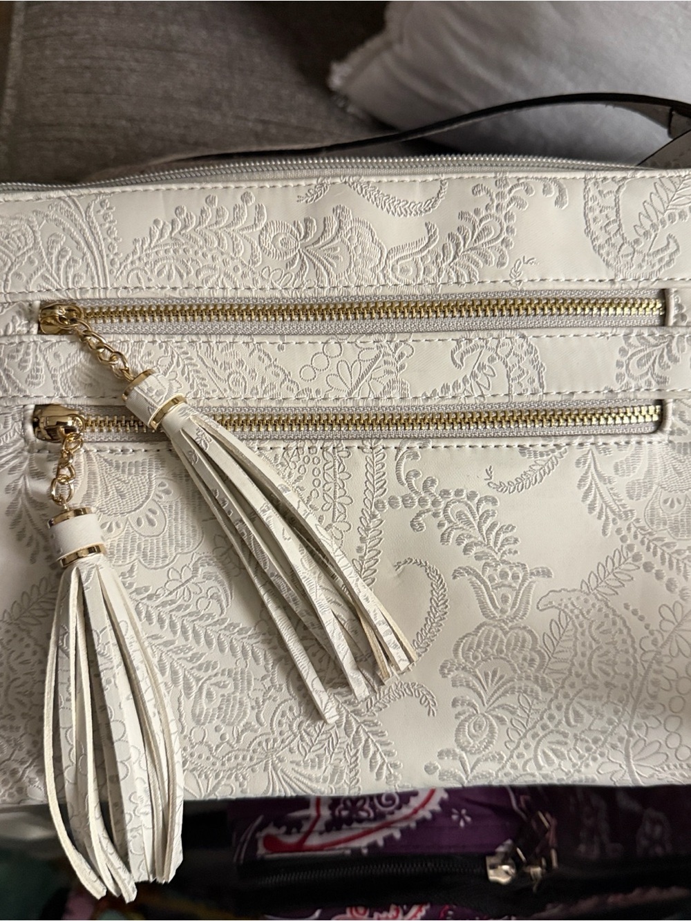 Women's White Crossbody Bag with Silvery Embossed Paisley and Tassel Zips